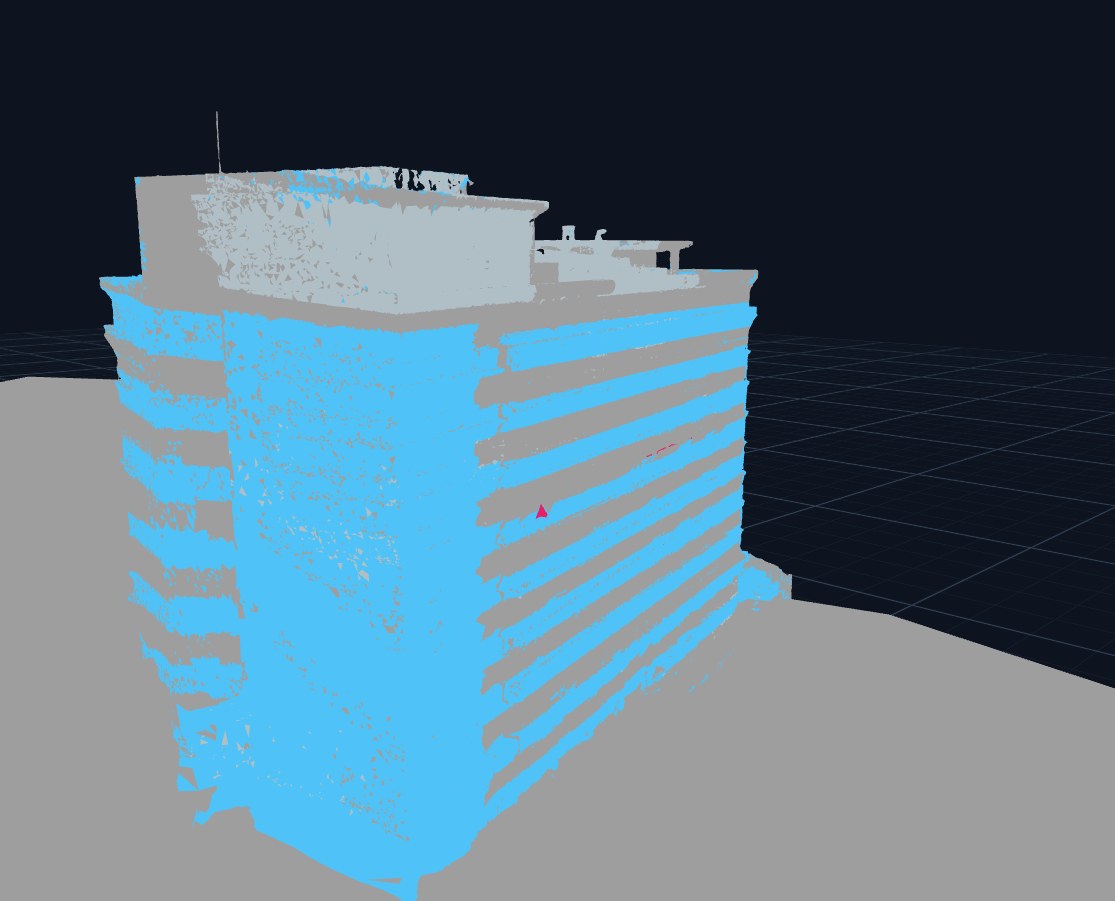 The drone-mapped FTC mesh after per-segment RF material assignment — glass curtain wall shown in blue
